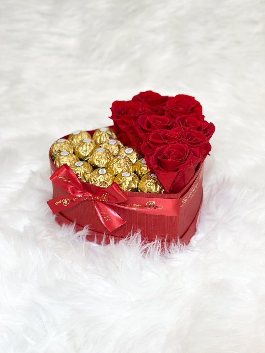 Red infinity roses and chocolate for Valentine's Day delivery in heart shaped box