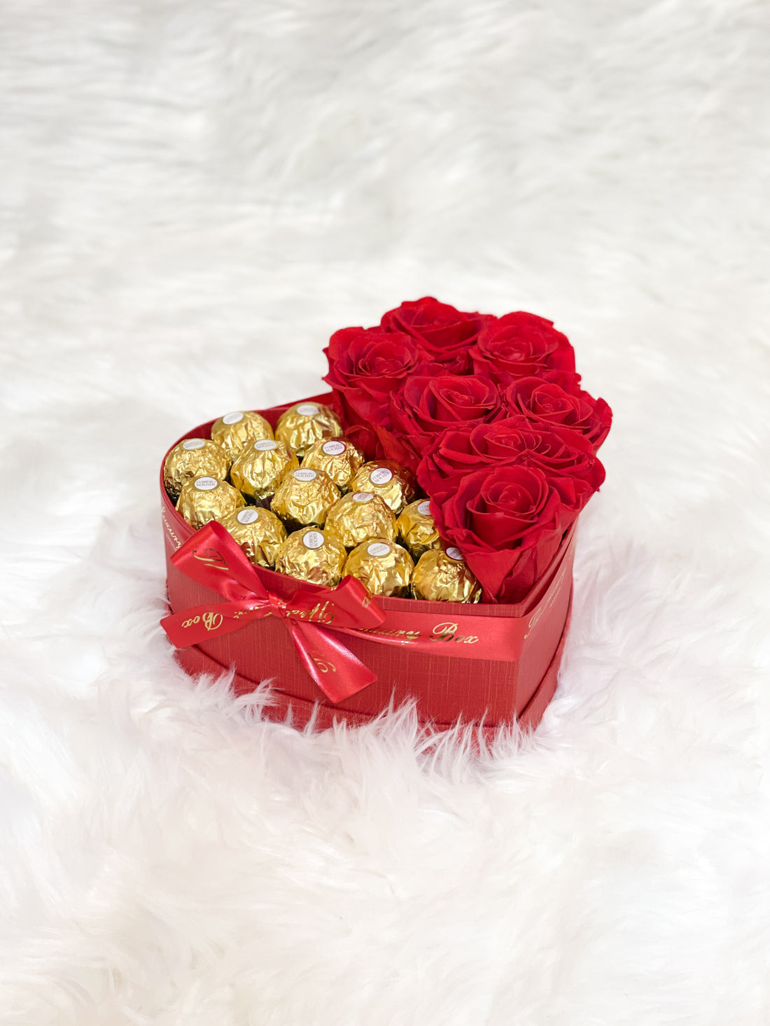 Red infinity roses and chocolate for Valentine's Day delivery in heart shaped box