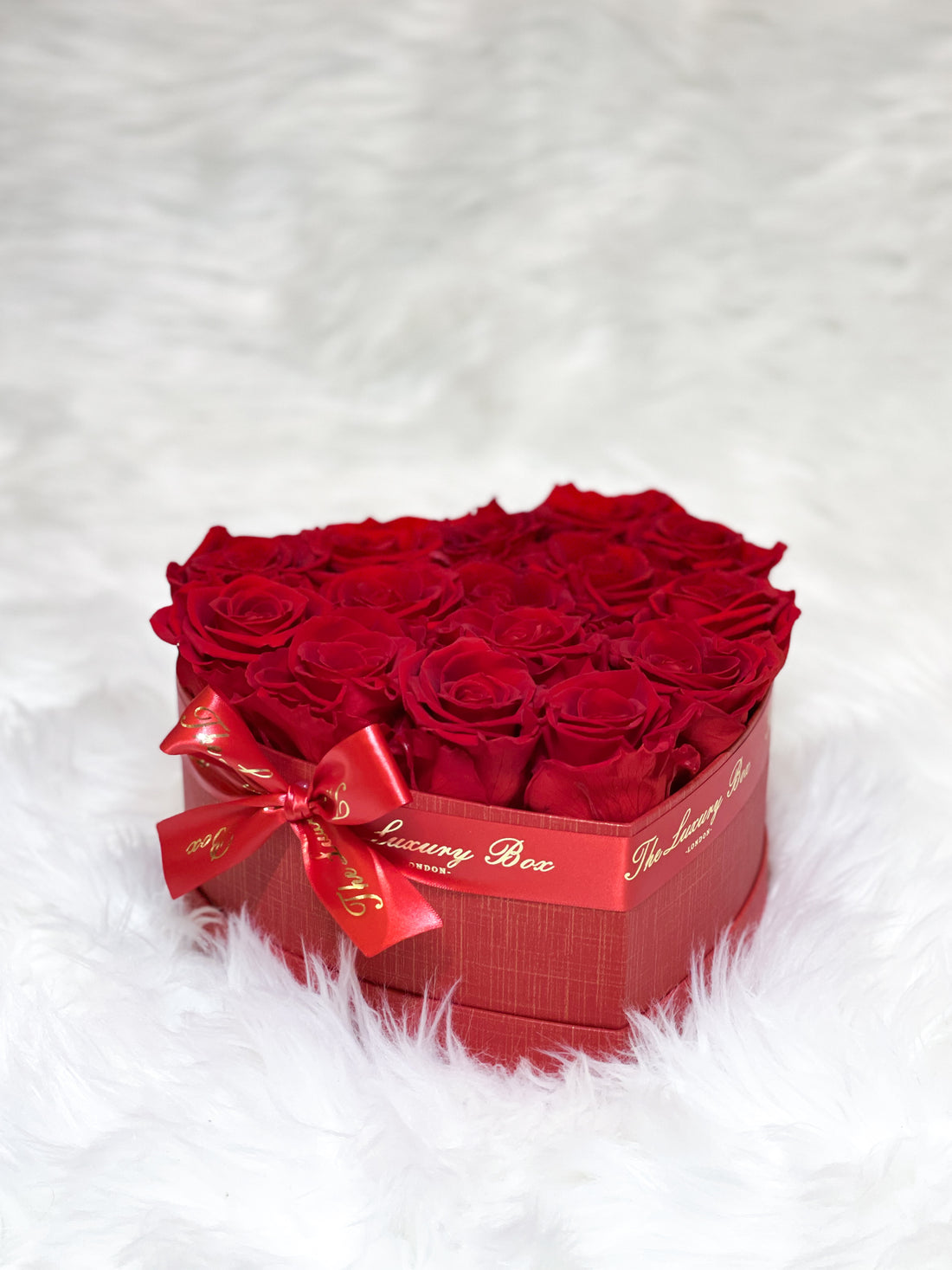 Red infinity roses for Valentine's Day delivery in heart shaped box