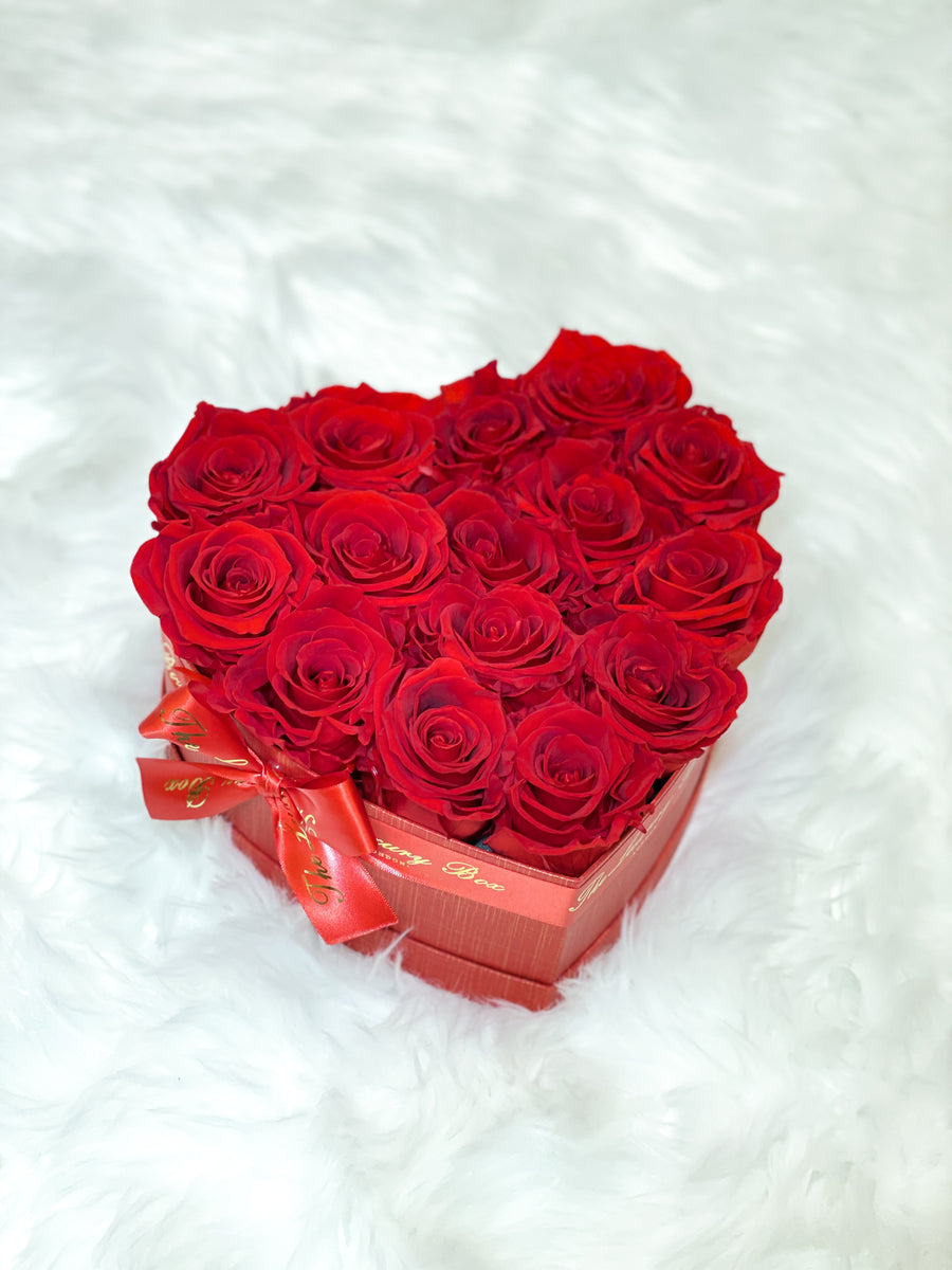 Red infinity roses for Valentine's Day delivery in heart shaped box